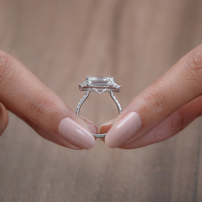 close view of asscher cut baguette halo accent diamond engagement ring