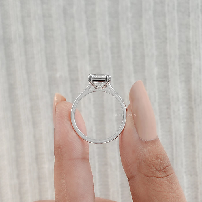 close view of asscher cut diamond double prong engagement ring