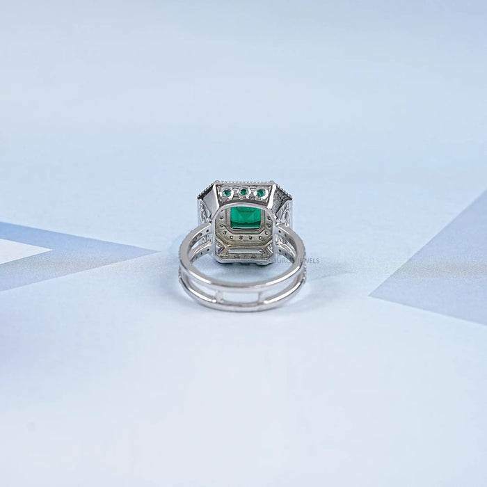 back view of green asscher cut gemstone diamond halo anniversary ring