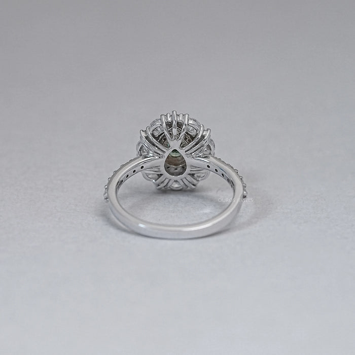 back view of green pear cut surround double halo diamond engagement ring