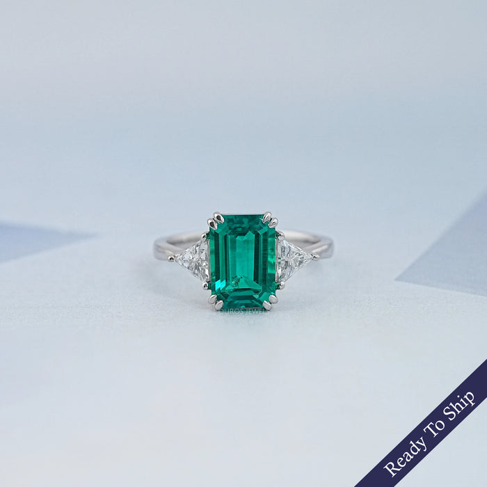 Emerald And Triangle Cut Trio Engagement Ring