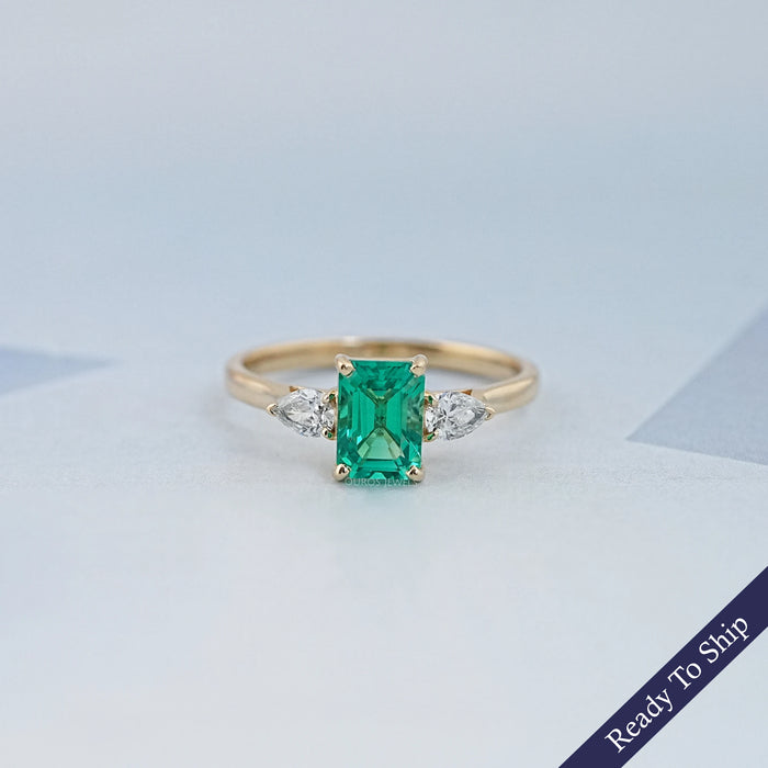 Emerald Gemstone And Pear Diamond Trio Engagement Ring