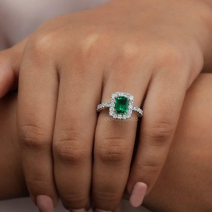 green emerald gemstone halo engagement ring