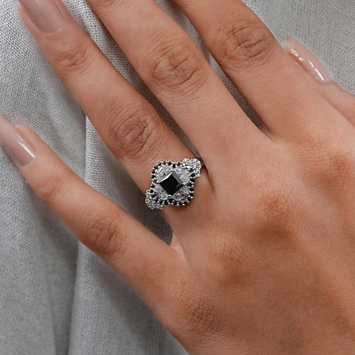 princess cut black diamond half moon halo engagement ring on model's hand