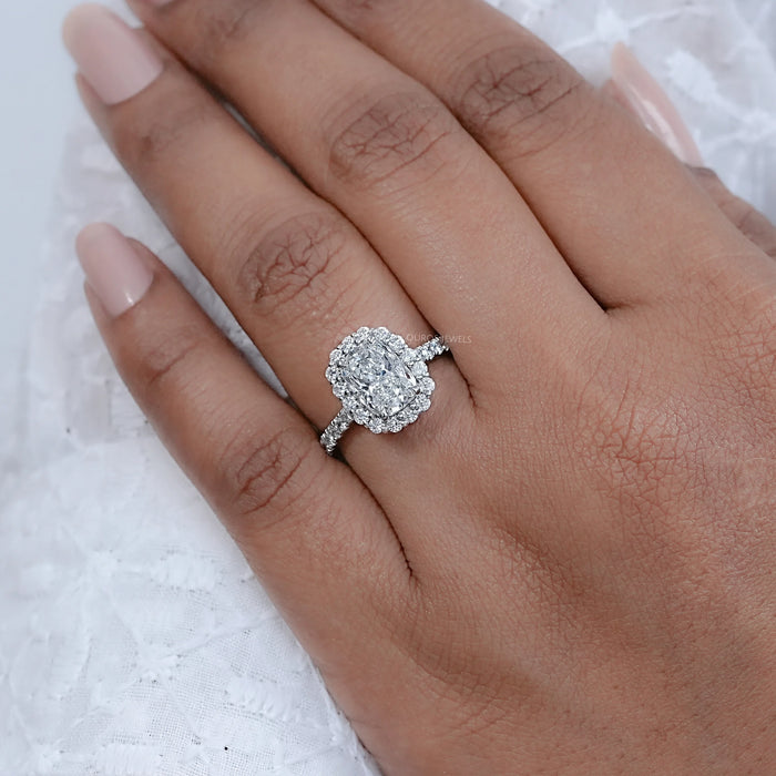 cushion cut lab diamond halo engagement ring in finger