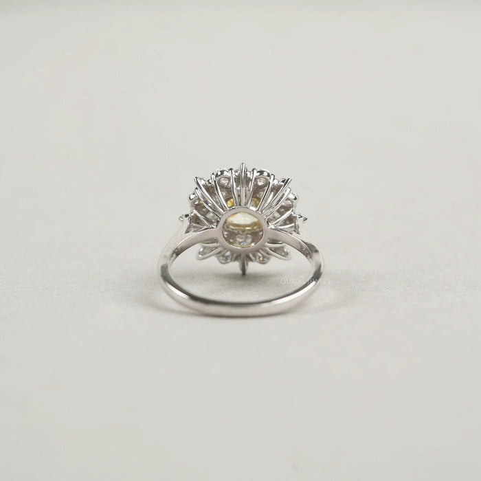 back view of fancy yellow cushion cut diamond with heart & pear sunburst halo ring