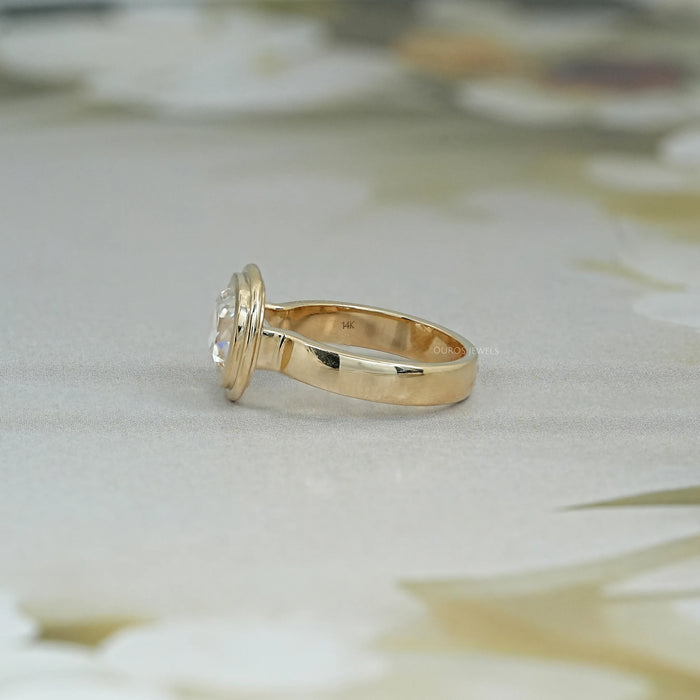 left side view of old mine cushion cut lab diamond bezel set engagement ring