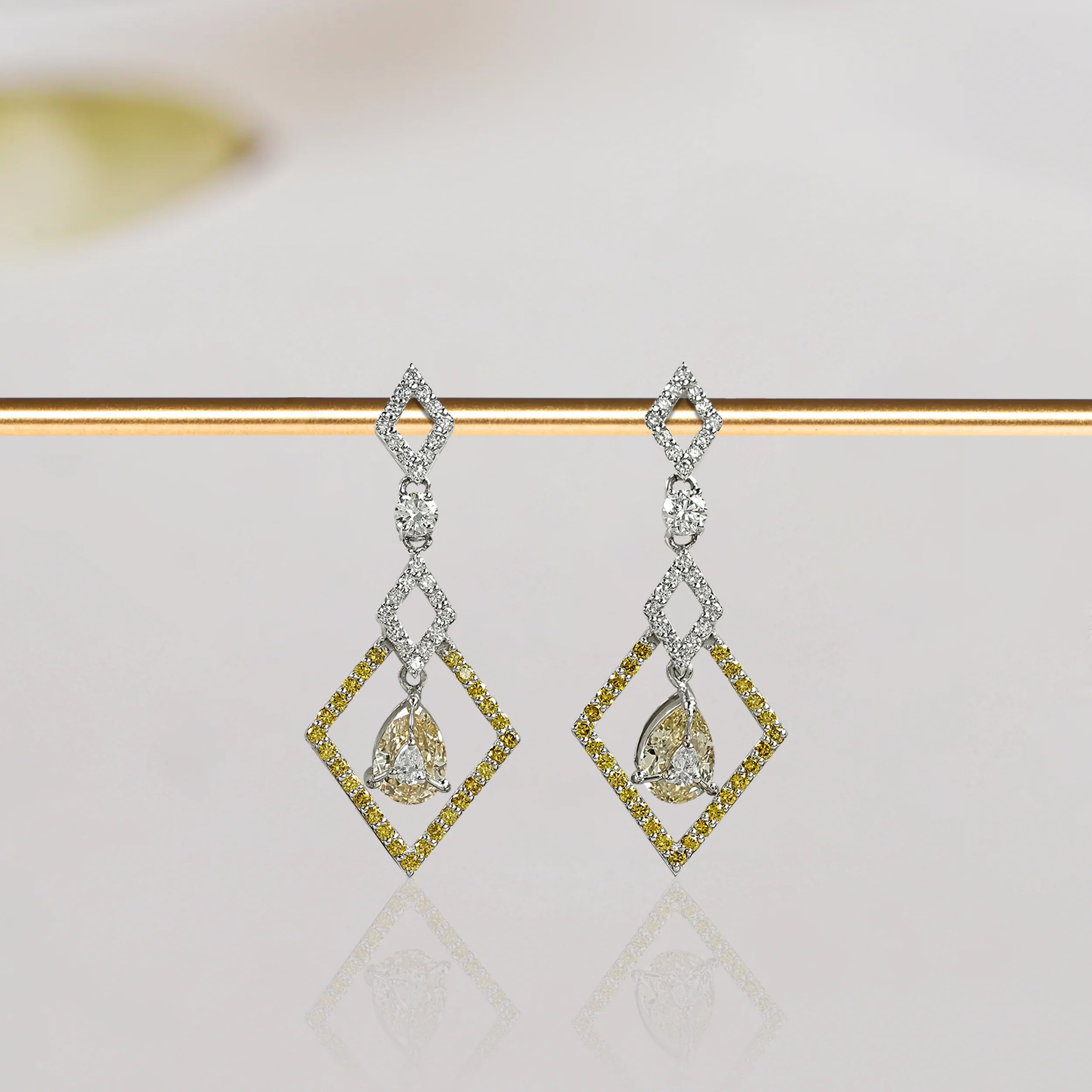 Yellow pear diamond dangle earrings