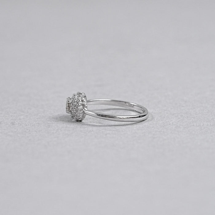 olive oval diamond halo engagement ring's side angle on grey background