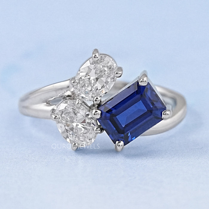 Emerald And Oval Cut Split Shank Diamond Ring