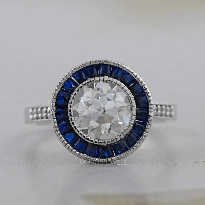 OEC Round Diamond Surround Sapphire Baguette Halo Ring