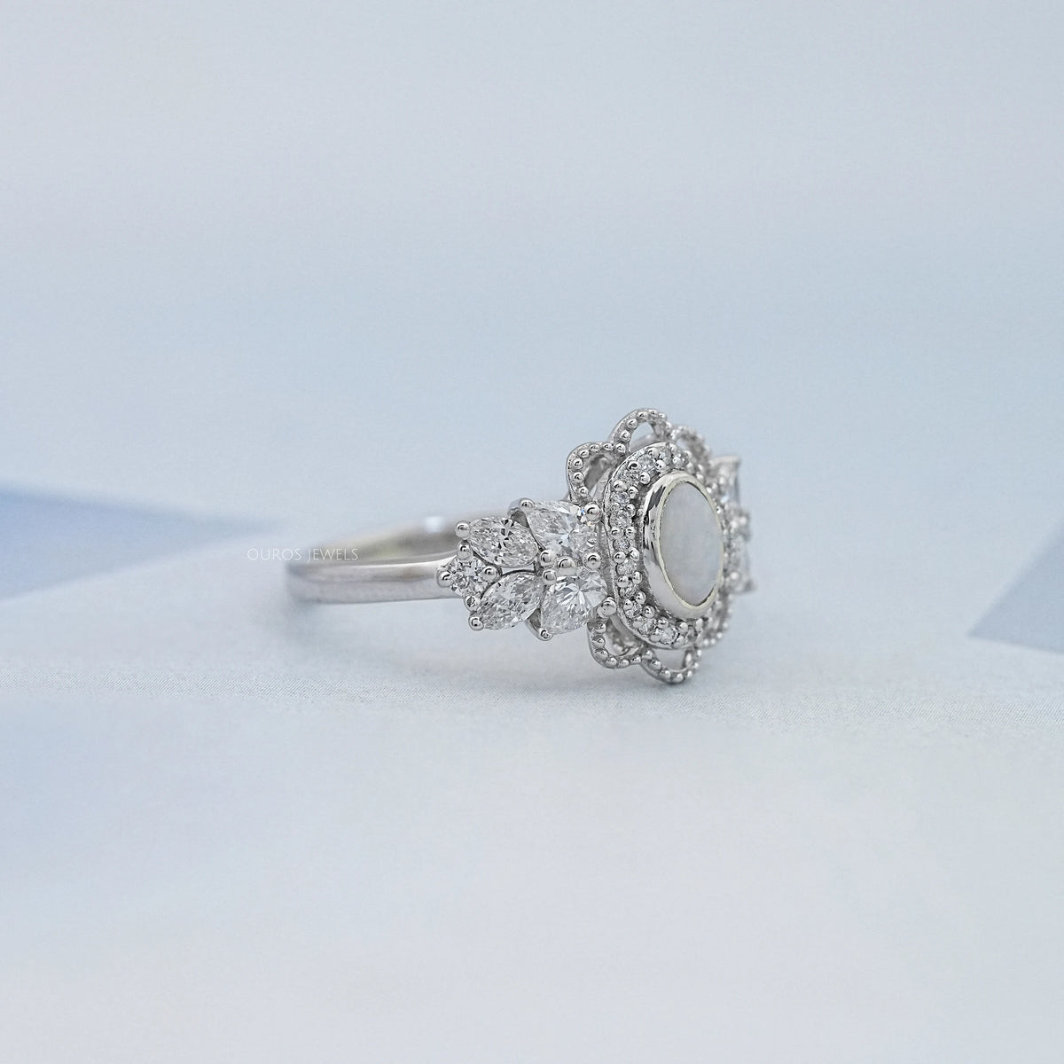 Opal Oval Cut And Halo Diamond Floral Engagement Ring