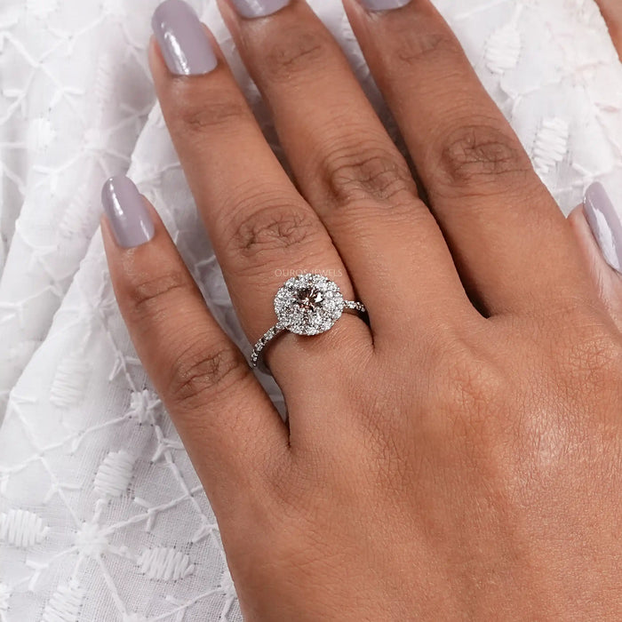 brown round shape lab diamond cluster halo engagement ring in finger