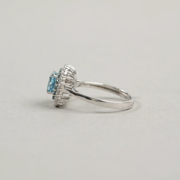 side view of fancy blue cushion cut lab diamond double halo wedding ring