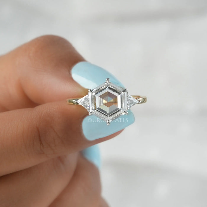 Three Stone Engagement Ring with a Hexagonal Step-Cut Diamond