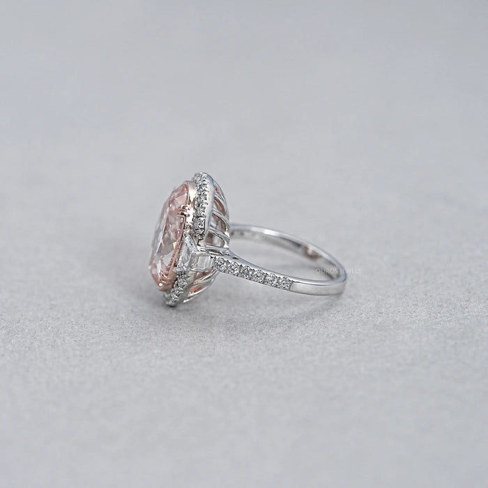 side view of pink oval lab diamond with trapezoid halo diamond ring