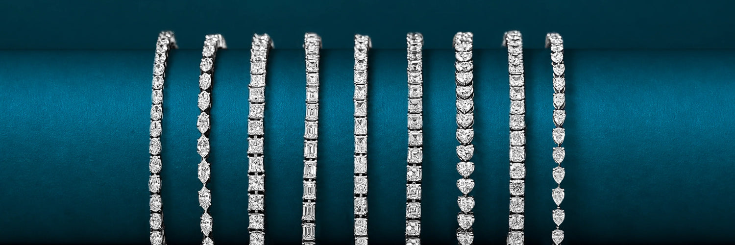 Seven lab-grown diamond tennis bracelets in white gold — marquise, oval, emerald cut, princess cut, round brilliant, heart cut, and pear cut full eternity tennis bracelets displayed vertically on teal background