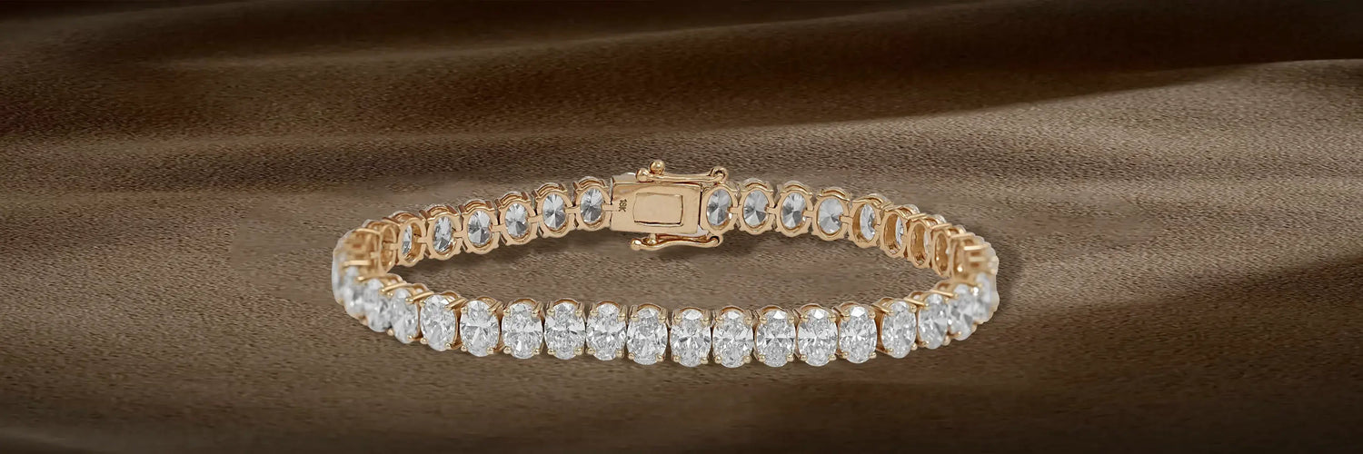  image Showing luxurious women's stackable tennis bracelet featuring emerald-cut lab-grown diamonds