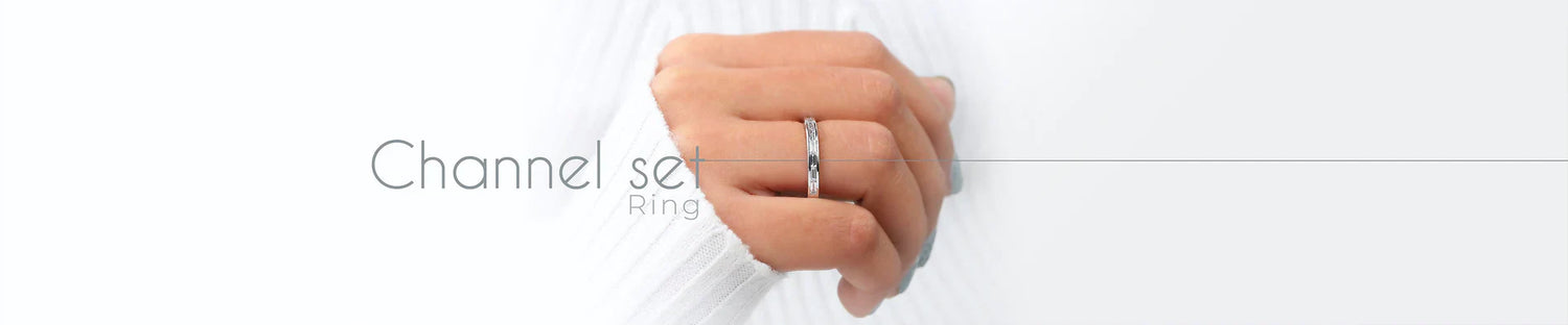 channel set diamond engagement ring weared by model in her hands 