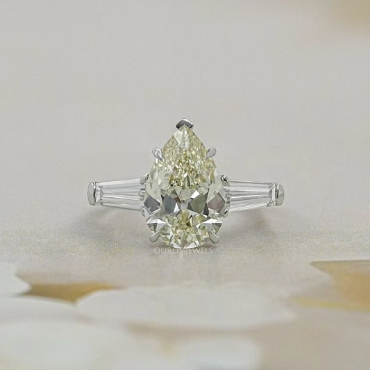 Pear Cut Three Stone Engagement Ring with Tapered Baguettes