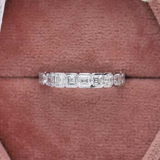 asscher cut diamond shared half bezel set eternity ring white gold in jewelry box