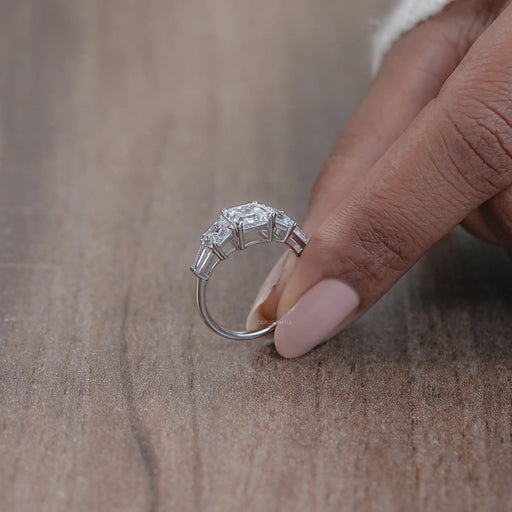 side view of asscher cut diamond five stone engagement ring with white gold band