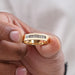 close view of baguette cut lab diamond yellow gold men's wedding ring