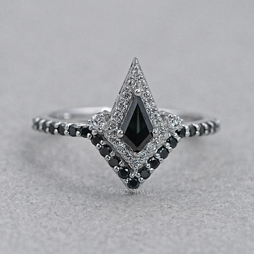 front view of black kite-cut lab diamond curved halo wedding ring on grey fabric