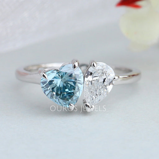 front view of blue heart and pear-cut lab diamond toi et moi wedding ring