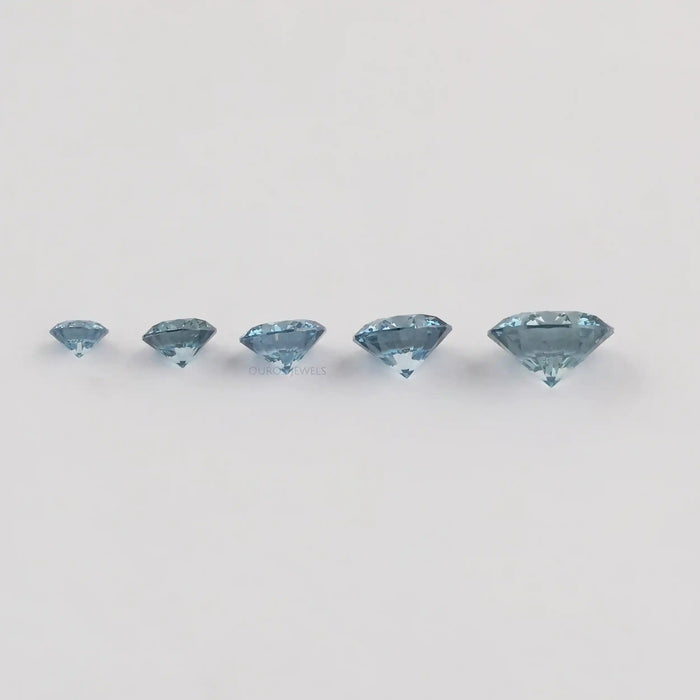 side view of blue round cut lab created colored diamonds loose