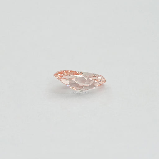 side view of pink brilliant oval cut lab made diamond loose