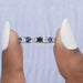 close view of blue cushion cut and round diamond eternity wedding band ring