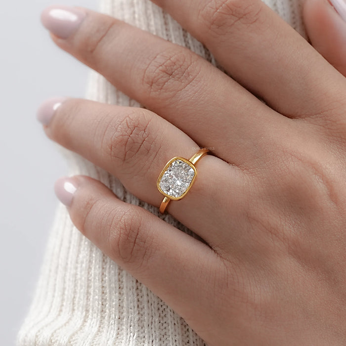 East West Cushion Diamond Bezel Set Solitaire Ring