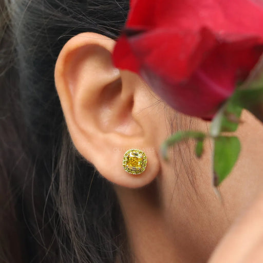 yellow cushion cut lab-grown diamond gold stud earrings halo showed in ear