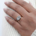 east west cushion cut lab diamond black coating engagement ring in finger