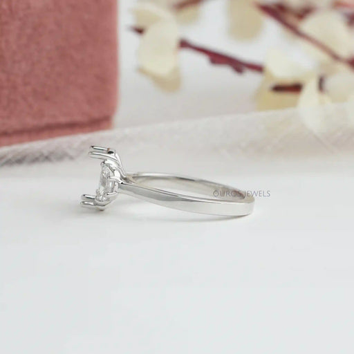 side view of oval-shaped half-moon-cut lab diamond semi-mount wedding ring