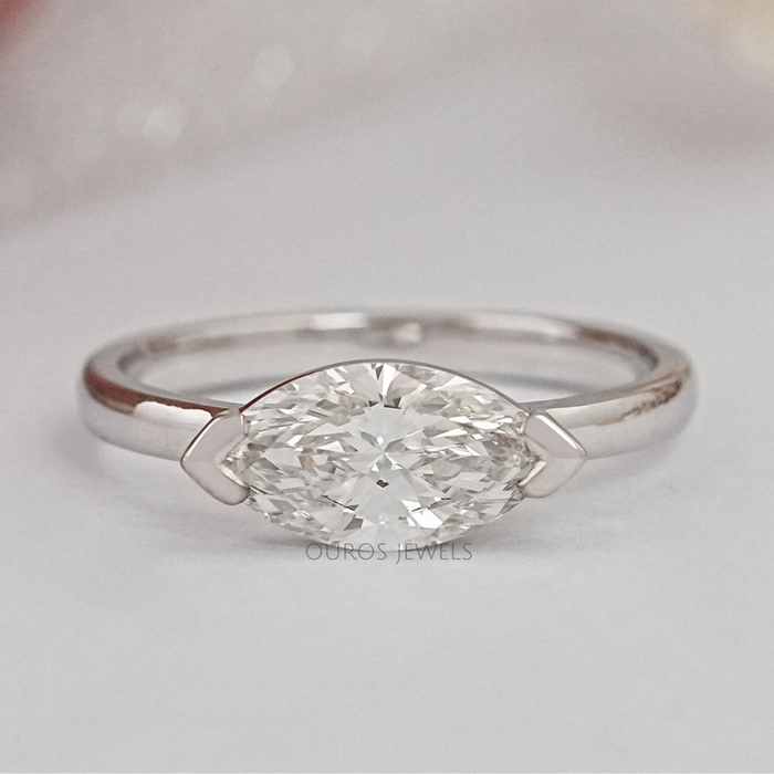 top view of east west set marquise diamond solitaire wedding ring