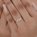 east-west old mine moval cut diamond half bezel engagement ring on model's finger