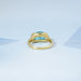 back view of east west blue oval cut gemstone wedding ring