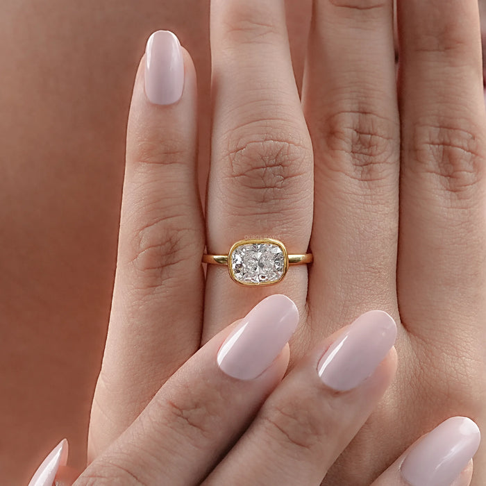 East West Cushion Diamond Bezel Set Solitaire Ring