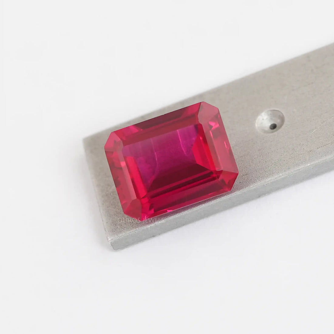 9.27 Carat Emerald Shape Light Red Ruby Gemstone