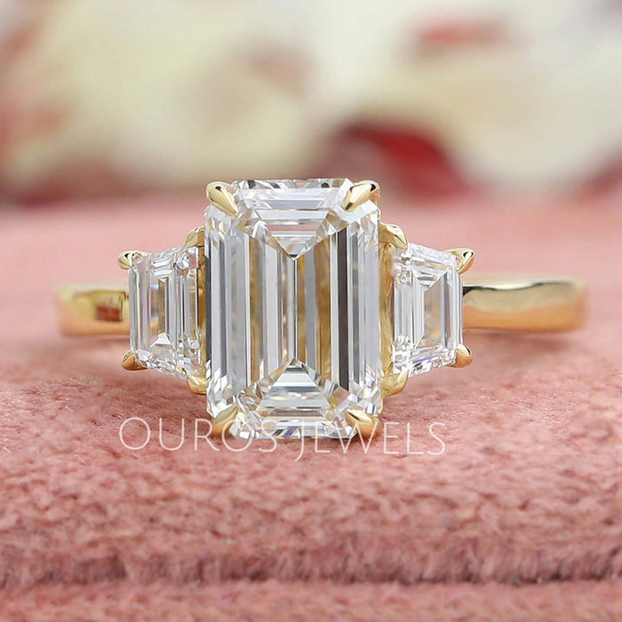 Emerald with Trapezoid Cut Diamond Three Stone Ring