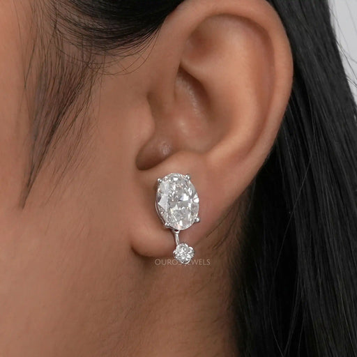 oval diamond with flower shape diamond jacket earrings white gold on ear