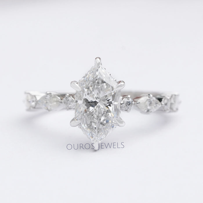 front view of dutch marquise cut and solitaire accent diamond ring on grey fabric