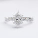 front view of dutch marquise cut and solitaire accent diamond ring on grey fabric