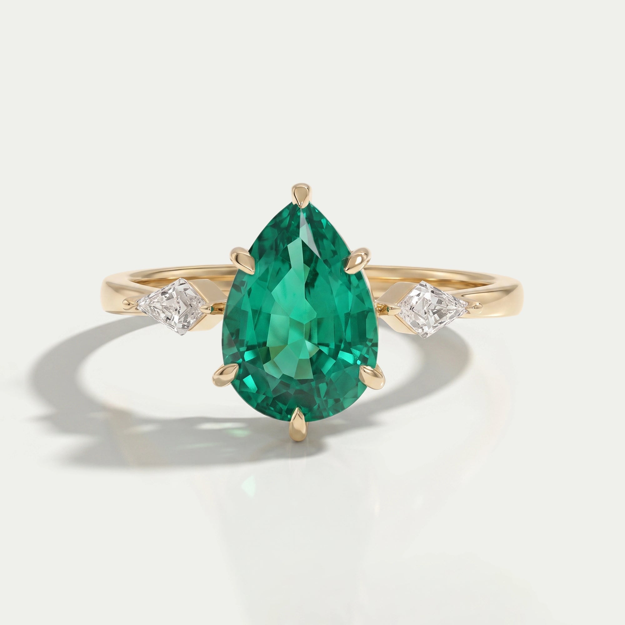 Green Pear And Kite Cut Three Stone Engagement Ring