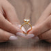 close-up view of heart-shape diamond bezel set solitaire engagement ring