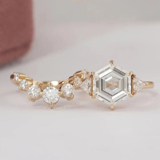 front view of antique hexagon-cut lab diamond curved three-stone bridal ring set