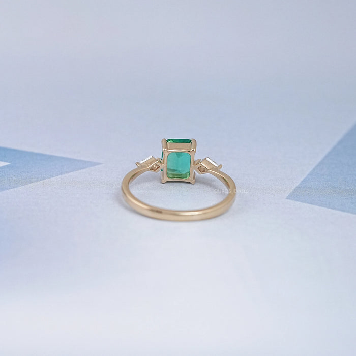 Emerald Gemstone And Kite Cut Three Stone Engagement Ring