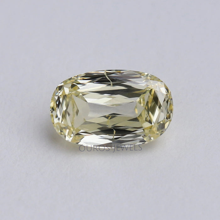 front view of vivid yellow old mine elongated cushion cut diamond loose